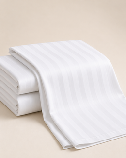 white flat striped bed sheet 